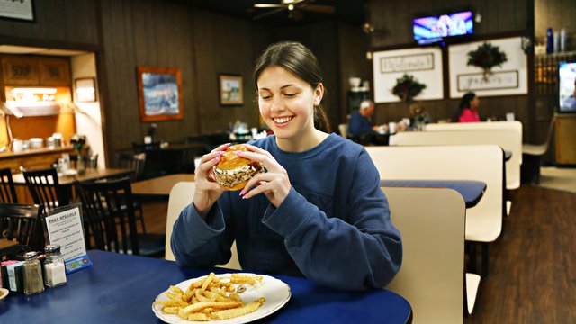 Restaurant-Cousin-Gary's-Pilot-Mountain-Ground-Steak-Trail-girl-eating.jpg